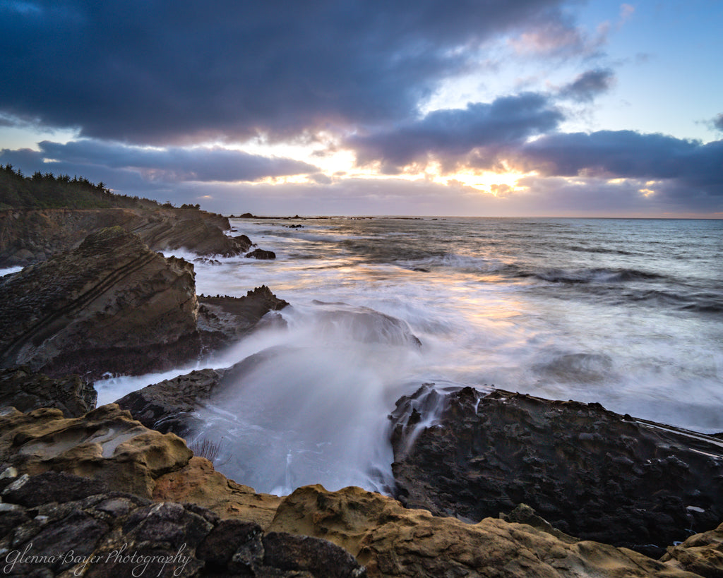 ocean wave flowing into rocky coast line