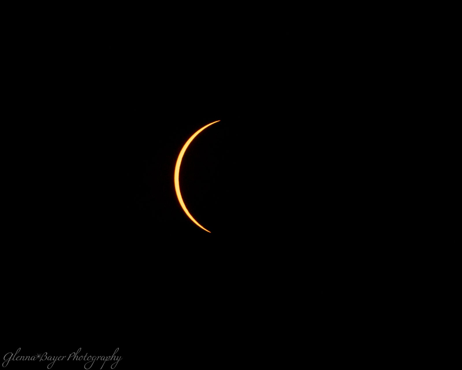 A crescent sun during a solar eclipse.