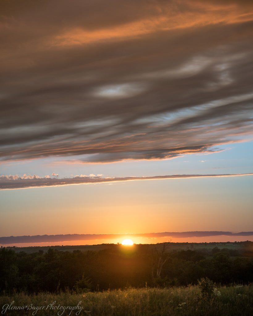 Orange sunset over Kansas landscape