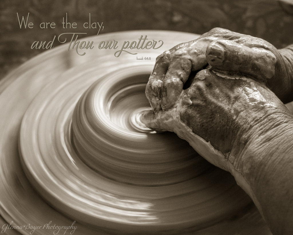 Old pottery&#39;s hand forming clay on potter&#39;s wheel with scripture verse