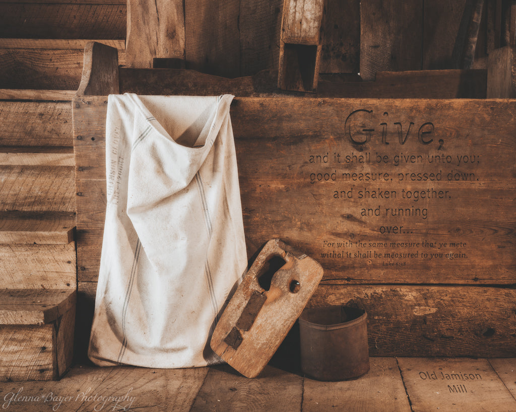 Flour bin and sack at Jamison Mill with bible verse