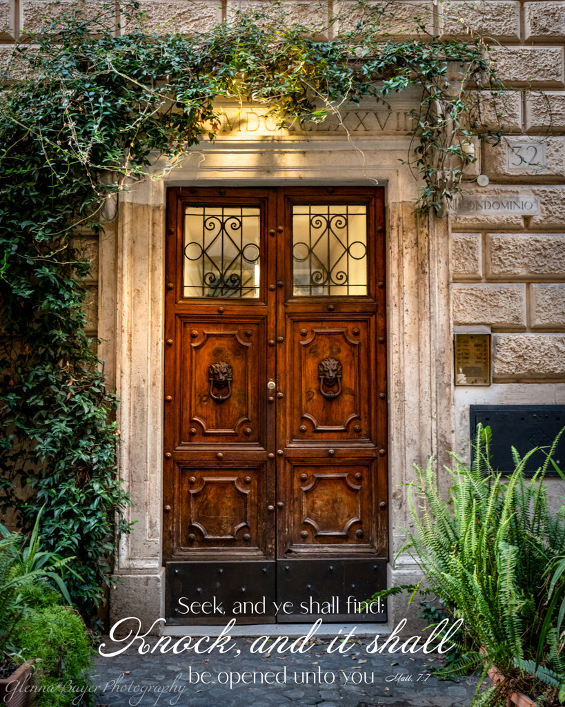 Old wooden door with ivy growing around it