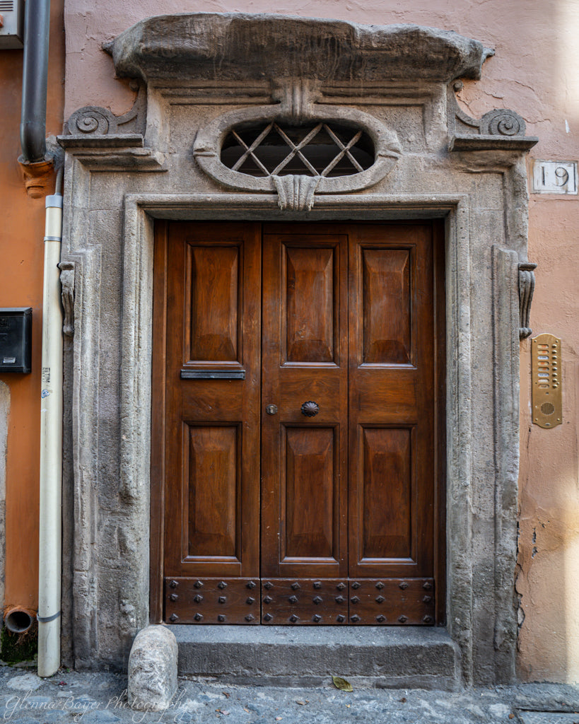 old wooden door framed with stone