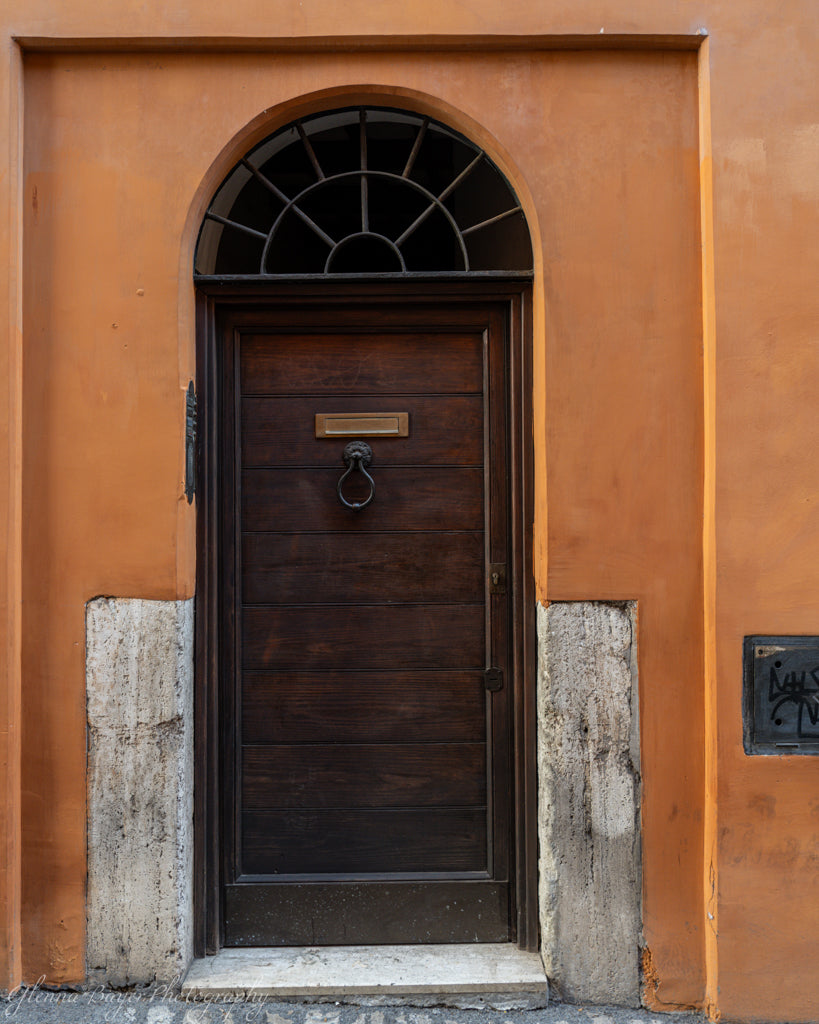 Arched doorway on orange building
