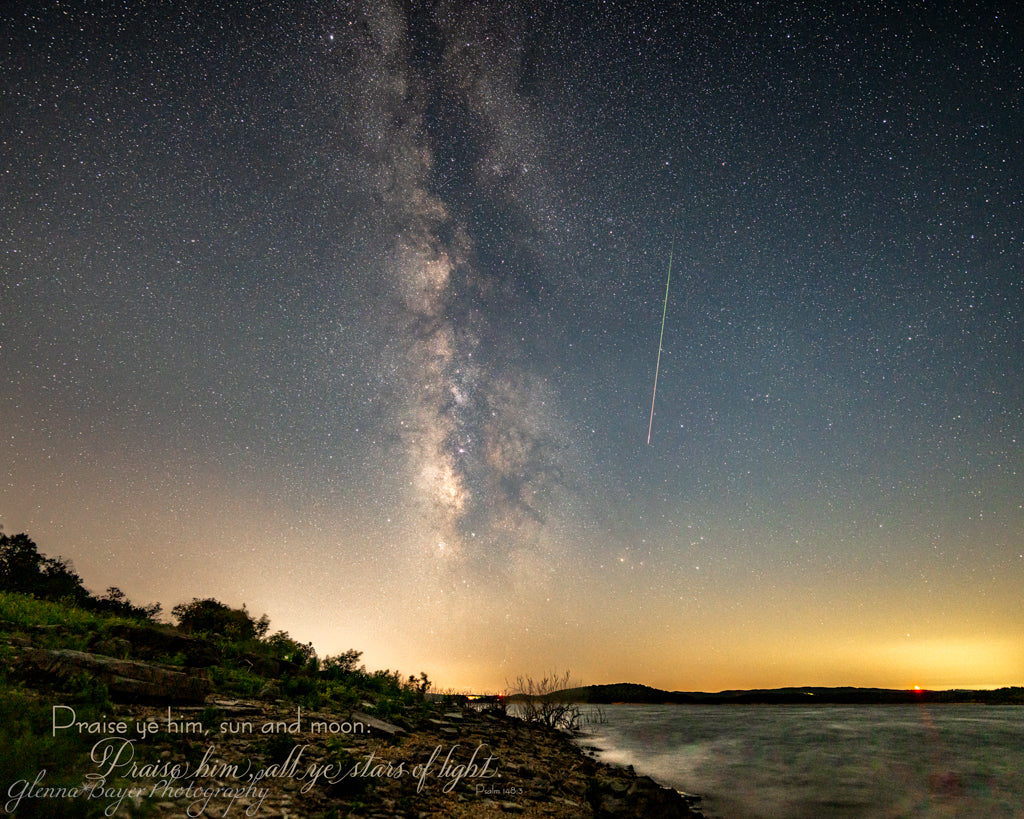 milky way and meteor above the lake edge