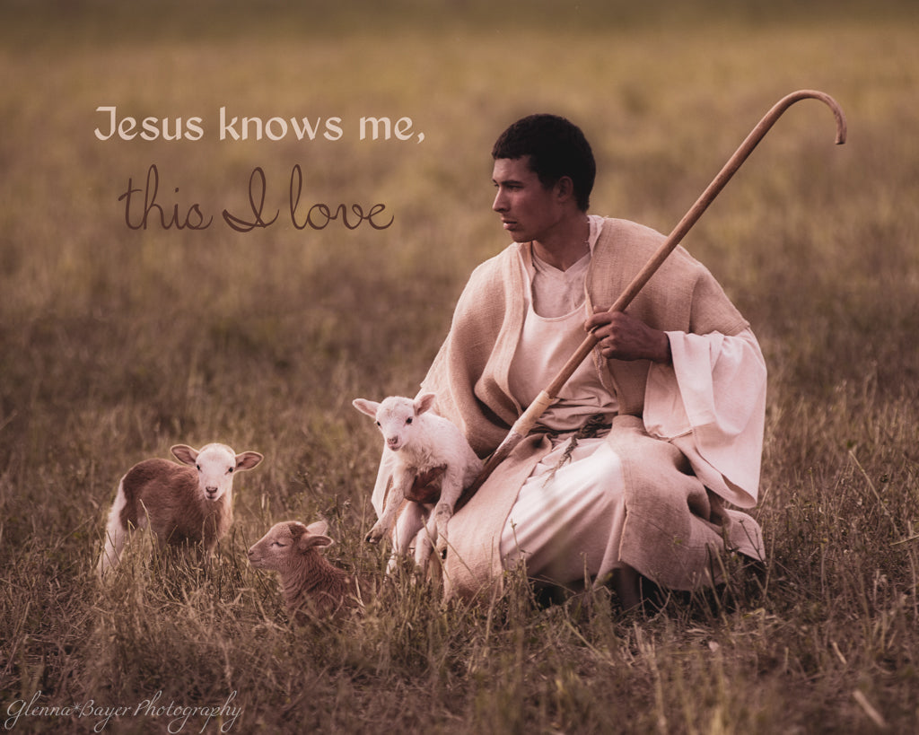 Shepherd with lambs