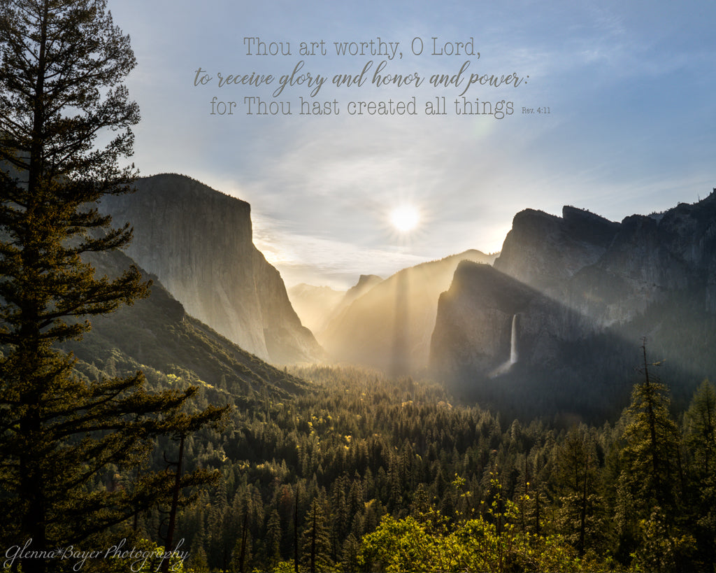 Sunrise over a mountain range with a bible verse about glory and honor.