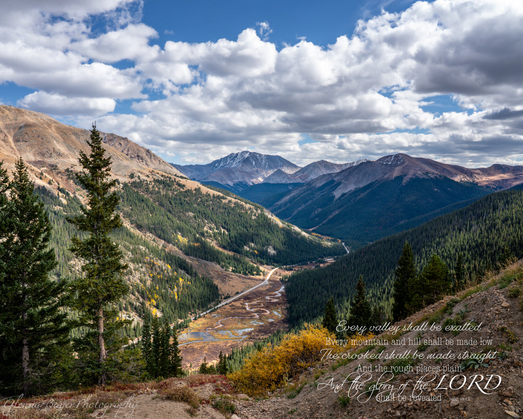 Scenic view of mountains and valleys with a clear blue sky.