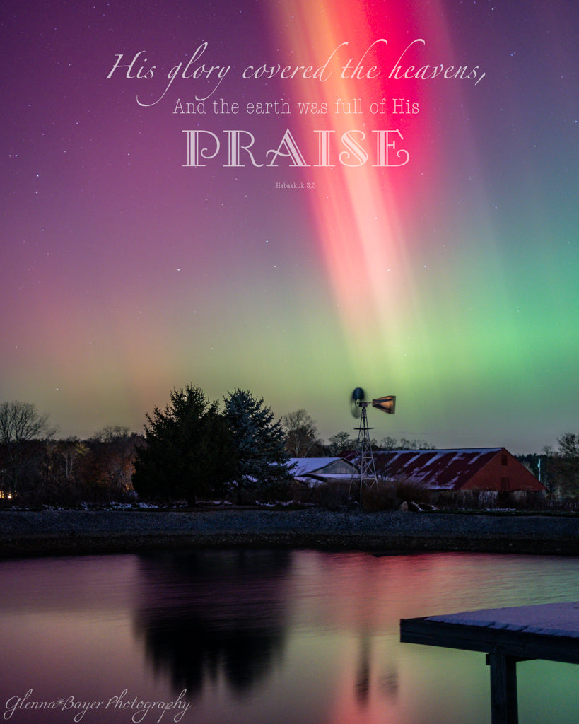 Aurora borealis over a lake with a windmill and dock, featuring a Bible Verse.