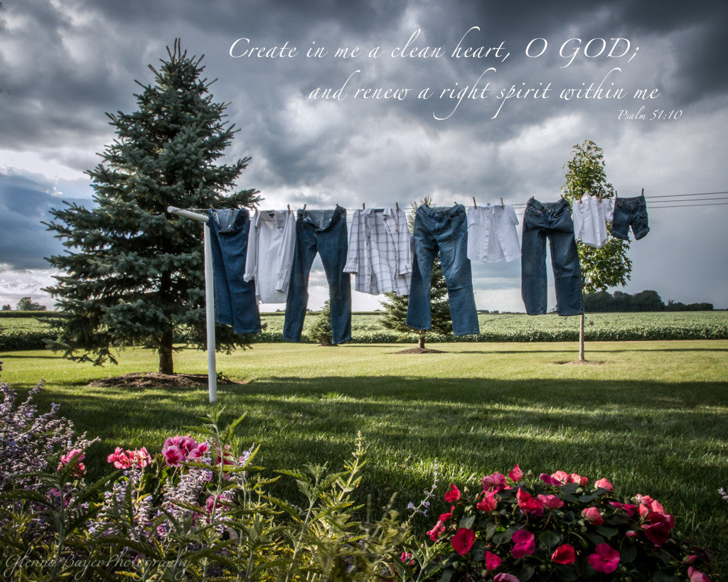 Jeans and shirts on clothesline with spring flowers and scripture verse
