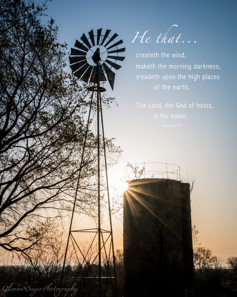 Silhouette of silo and windmill at sunrise in Kansas with scripture verse