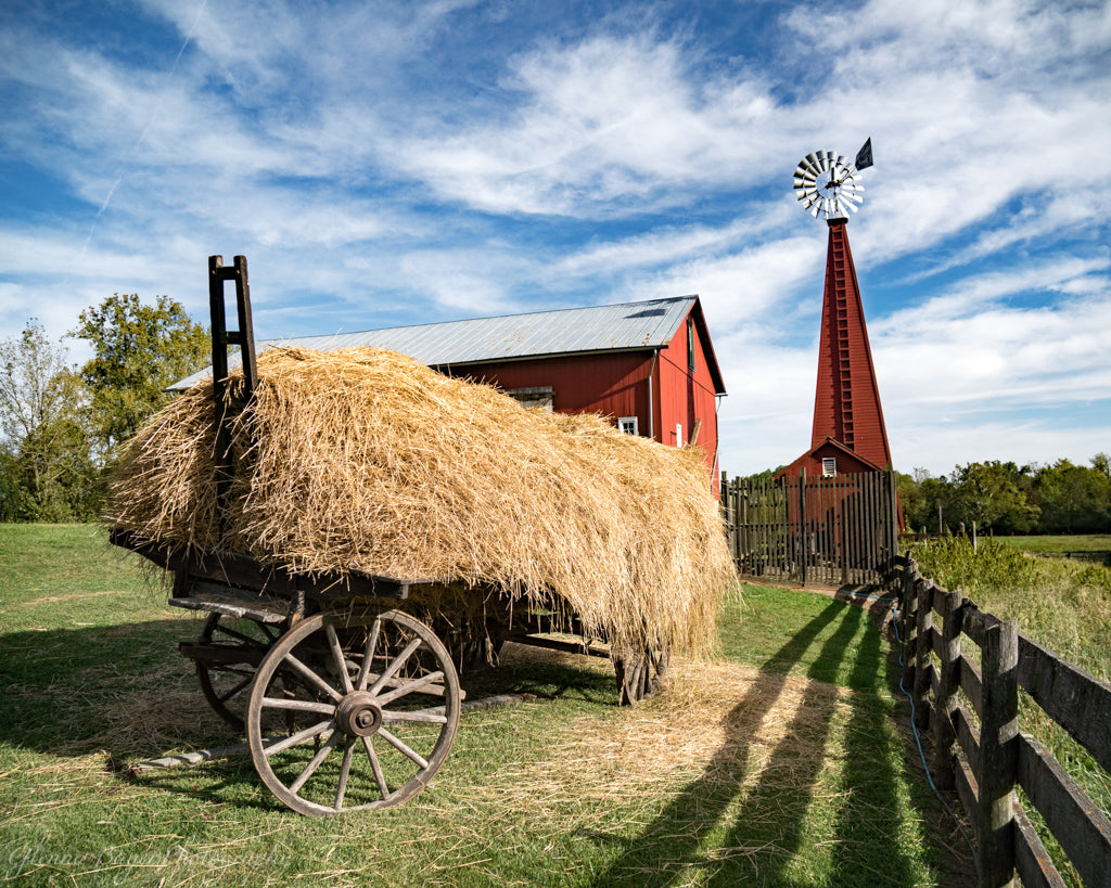 Straw wagon, red barn, and windmill