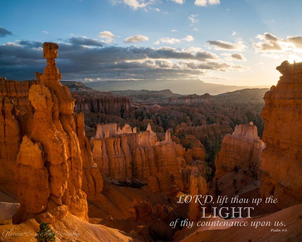 Hoodoos and arch at sunrise in Bryce Canyon National Park with bible verse.
