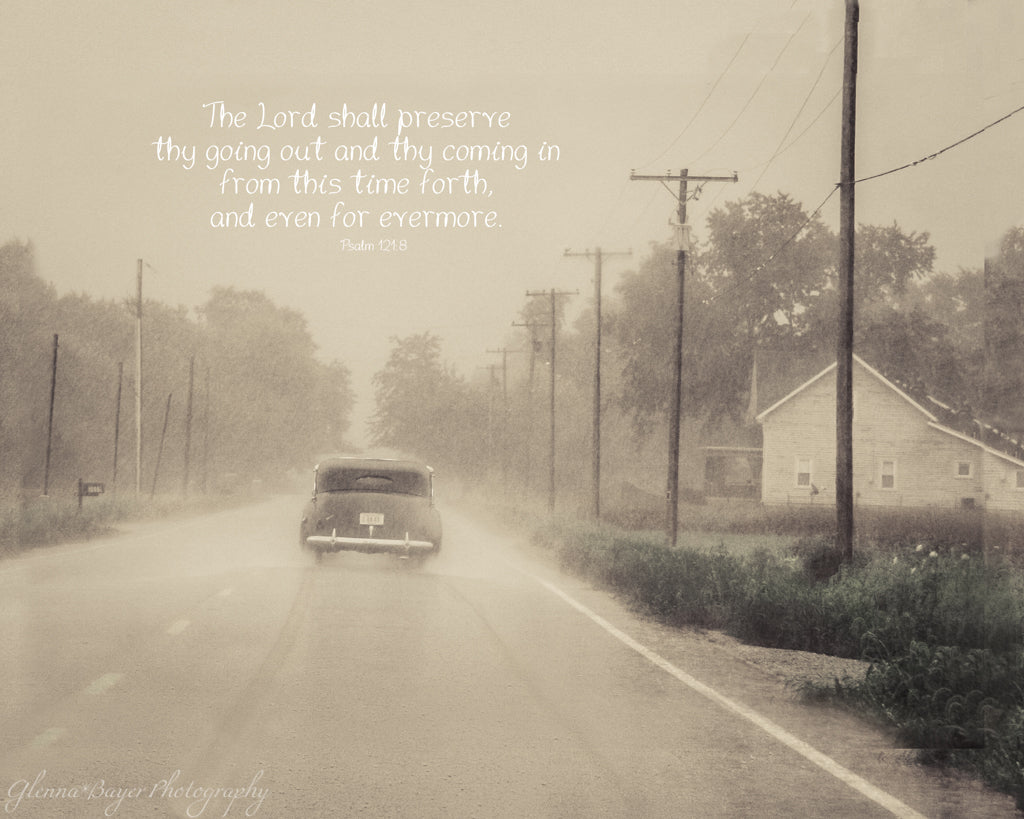 Old vintage car driving through rain on Route 41 with scripture verse