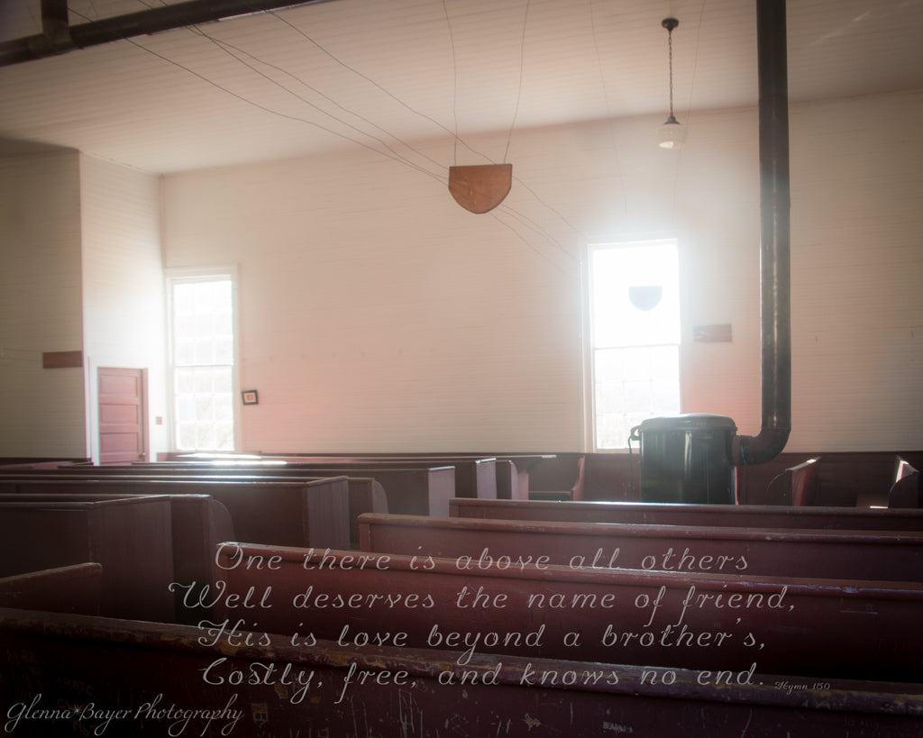 Old German Baptist Brethren Church with wooden benches and stove with song verse