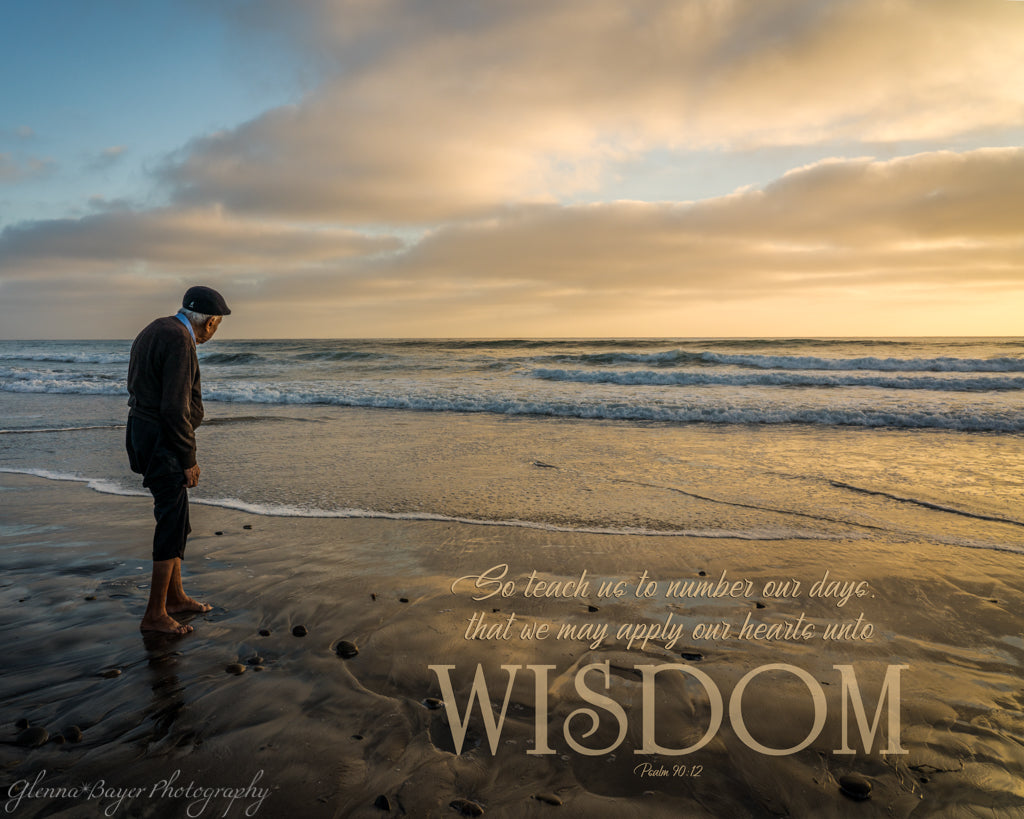 Old man standing next to the sea watching the sunset in San Diego with scripture verse