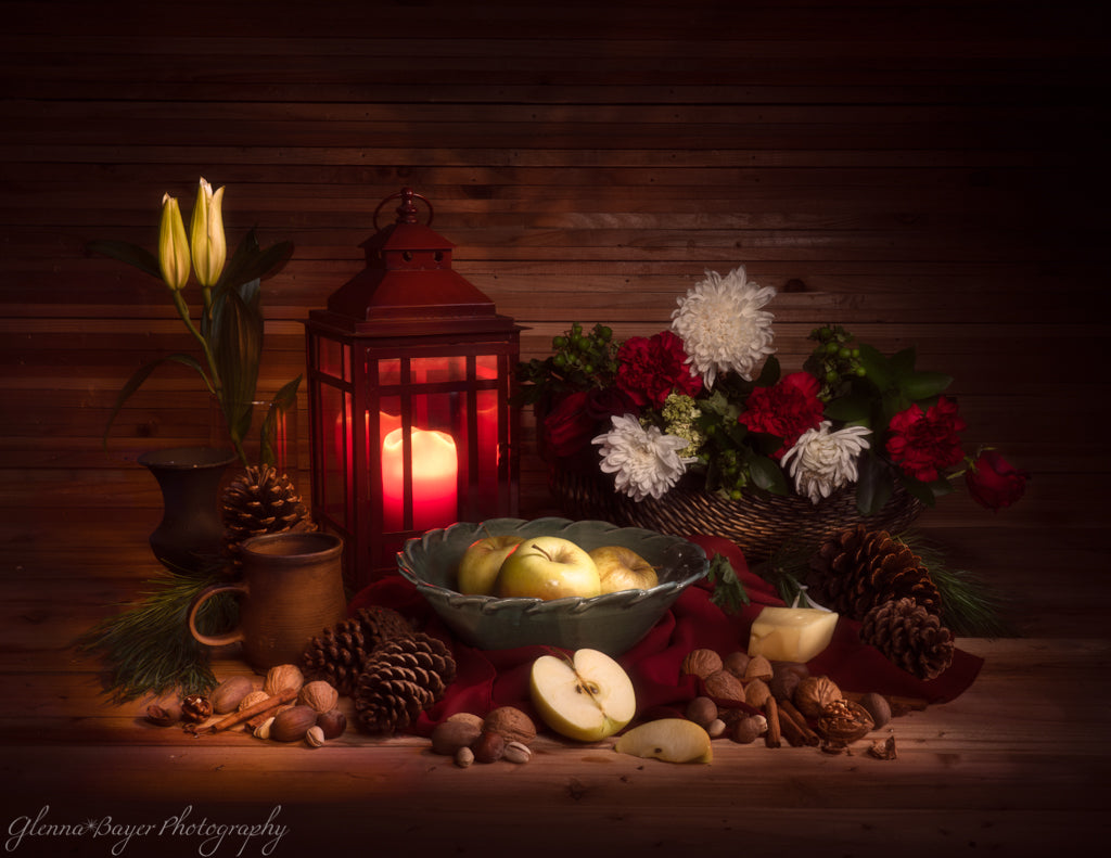 winter still life with candle, fruit, nuts, flowers