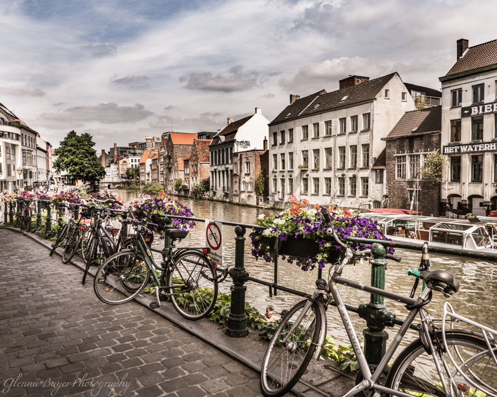 Bicycles leaning on railing in Ghent