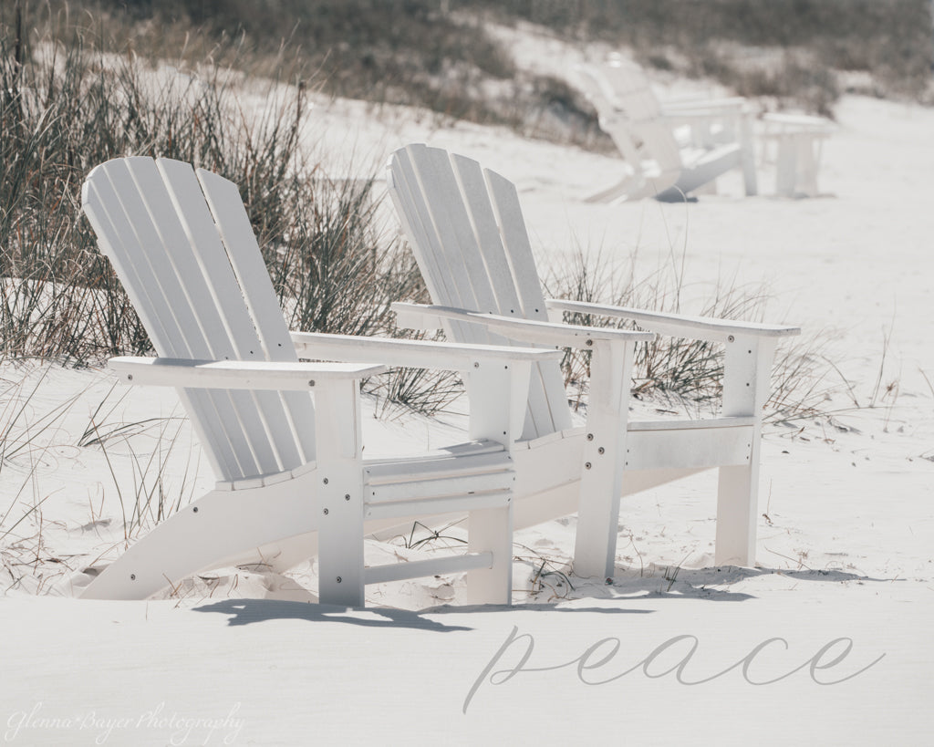 white chairs on white beach