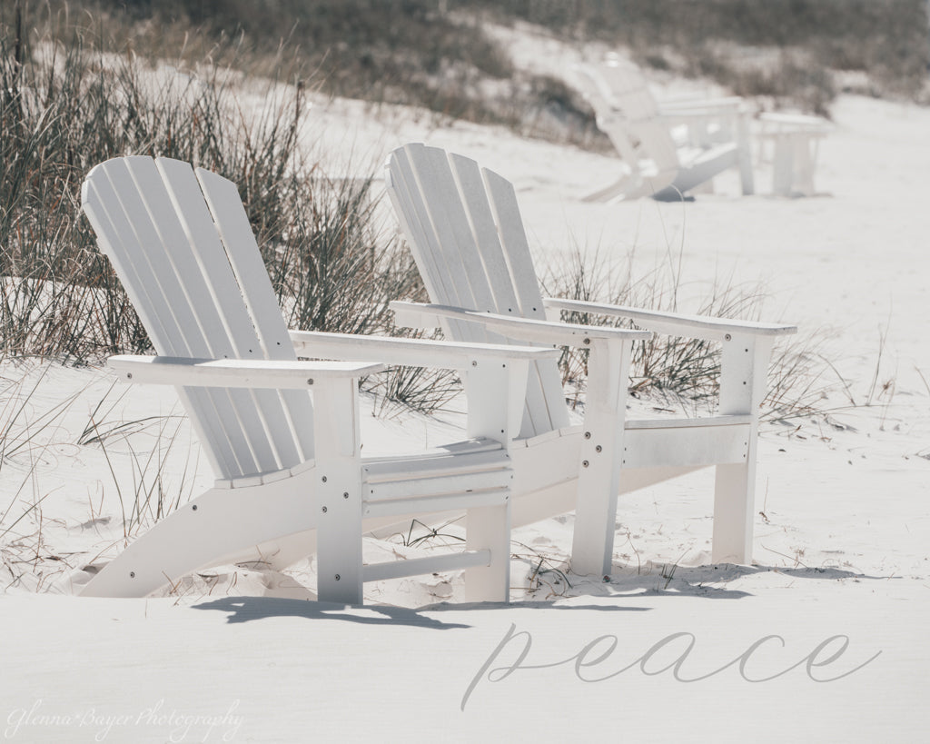 white chairs on white beach 