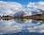 Snowy mountains and lake reflection with bible verse