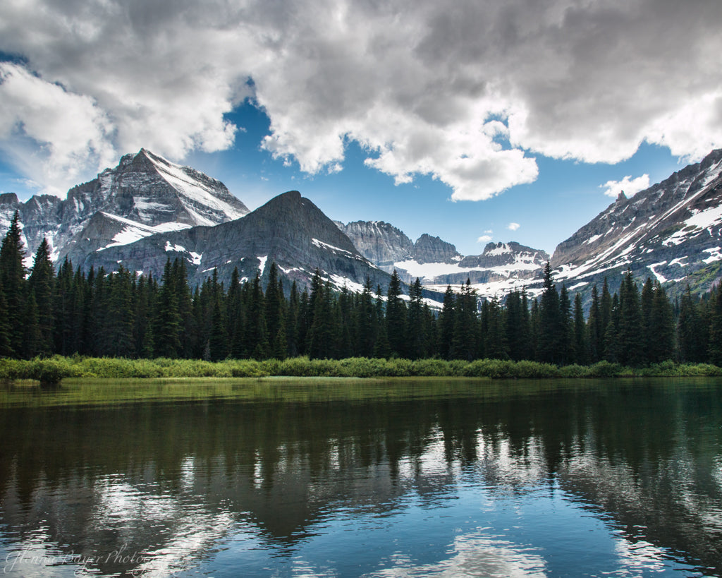 Lake Josephine in summer with snowy mountains in Glacier National Park