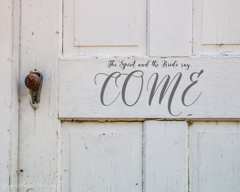 Old white church door with scripture verse
