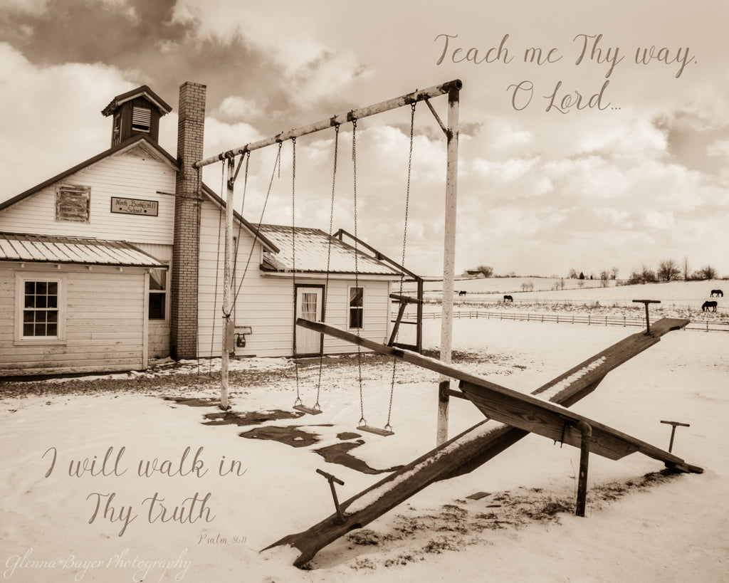 Amish schoolhouse and playground with scripture verse