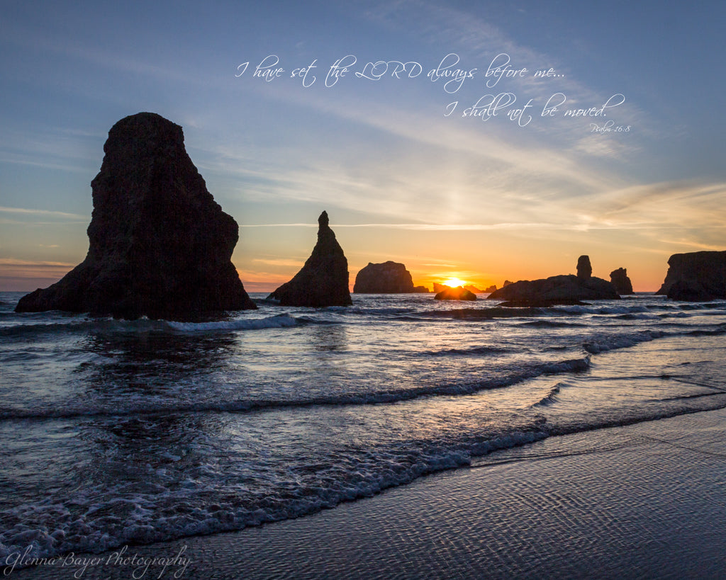A blue, yellow sunset at Bandon Beach in Oregon with scripture verse