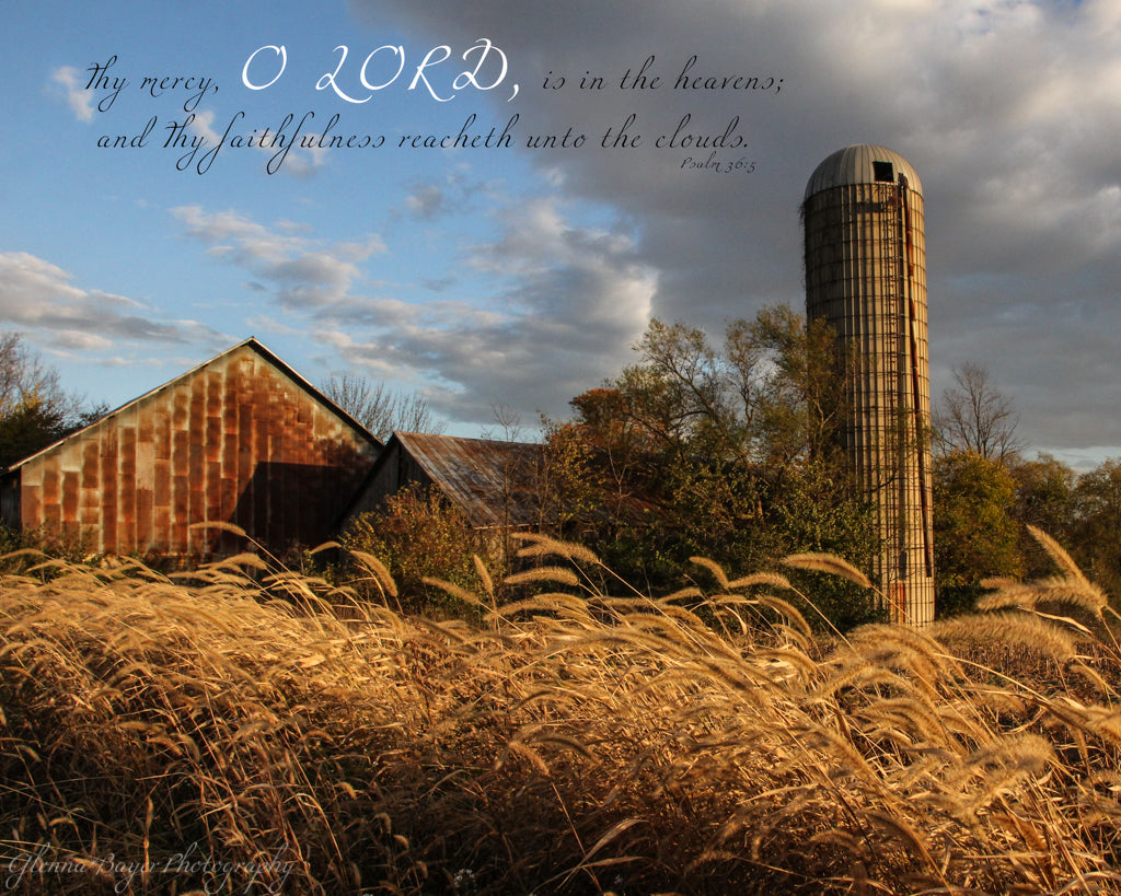 Old barn, silo, and wheat in evening light with scripture verse