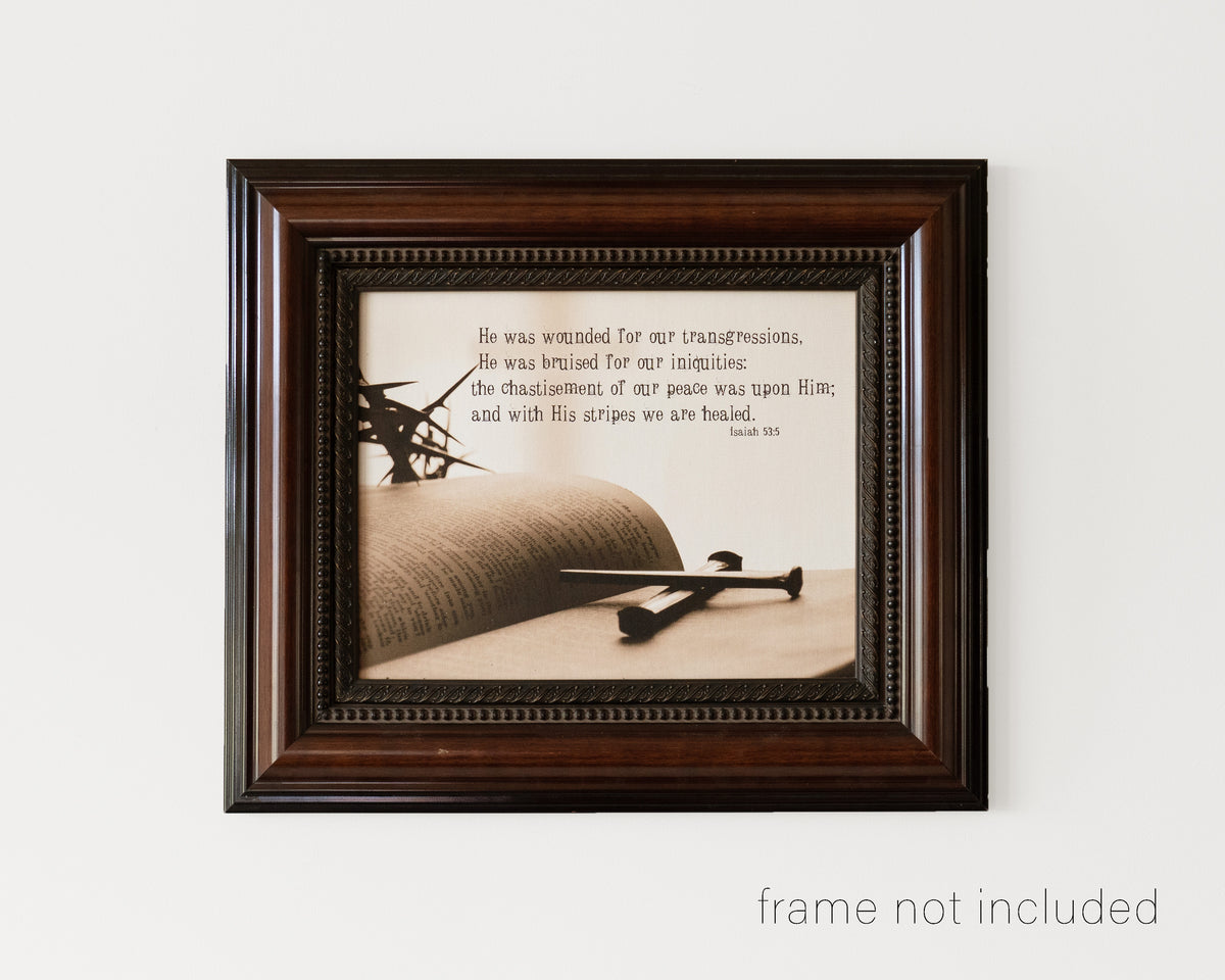 framed print of Crown of thorns and nails lying on open Bible with scripture verse