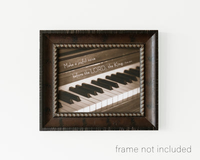 framed print of piano keys with scripture verse