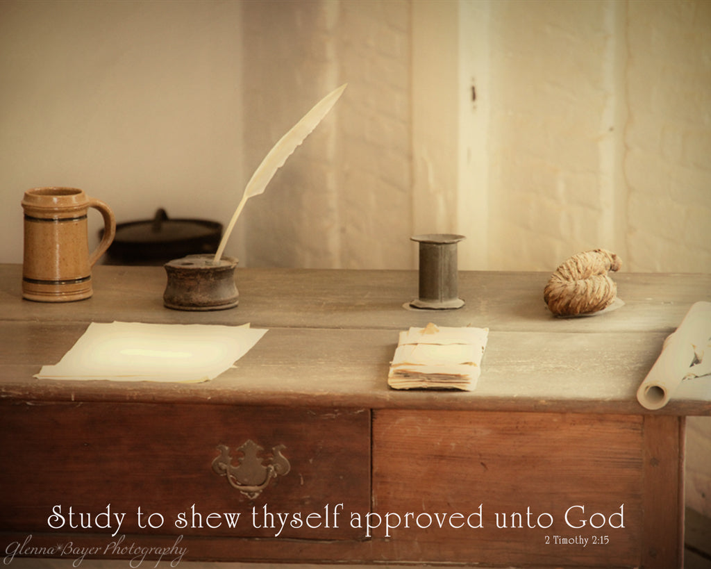 Old writing desk with paper and ink quill in Mount Vernon, Virginia with scripture verse