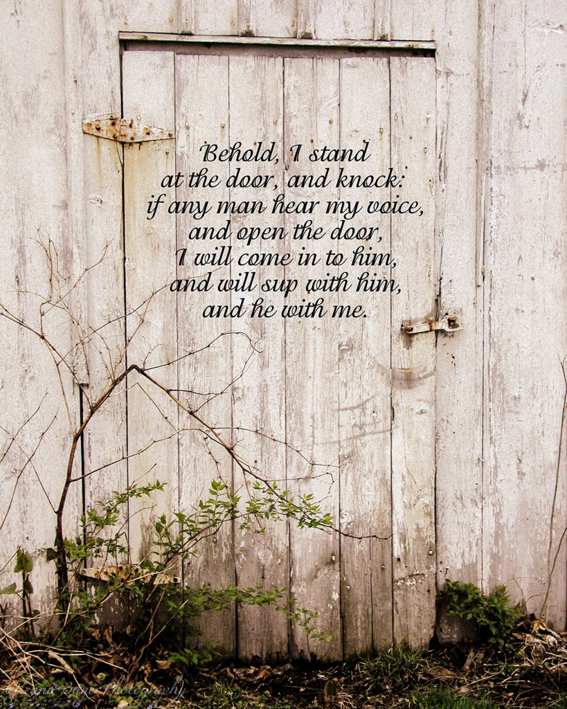 Old white barn door with scripture verse