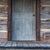 Old log cabin's gray door