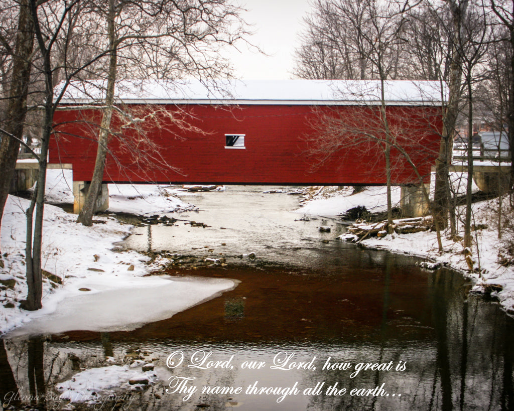 Red covered bridge during a snowy winter day in Eaton, Ohio with scripture verse