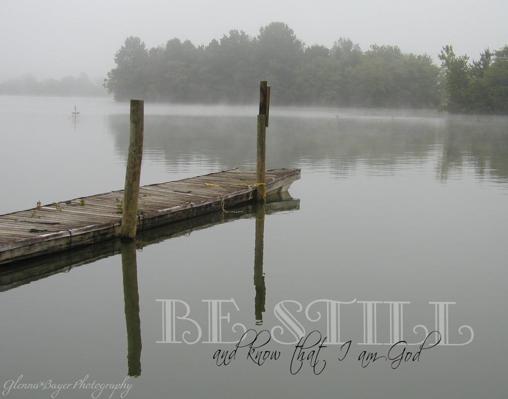 Old wooden dock over a lake on a foggy, gray morning with scripture verse