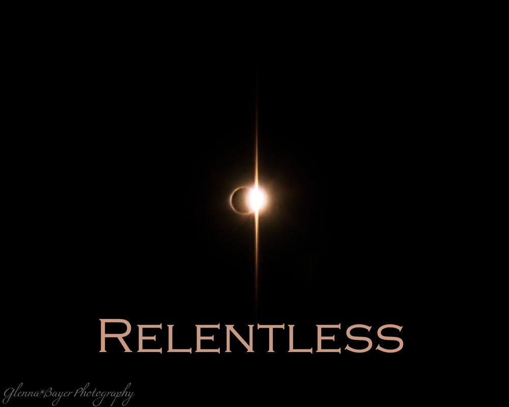 The diamond ring phase of a solar eclipse with the word "relentless"