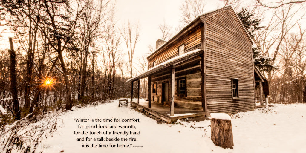 Old log cabin in winter at sunset with inspirational quote