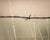 Barbed wire fence with wheat field in Kansas with scripture verse
