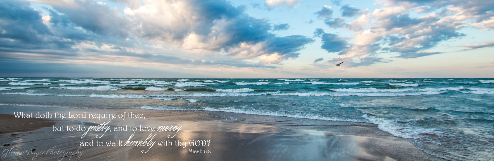 Panorama of waves across beach at Lake Michigan with scripture verse