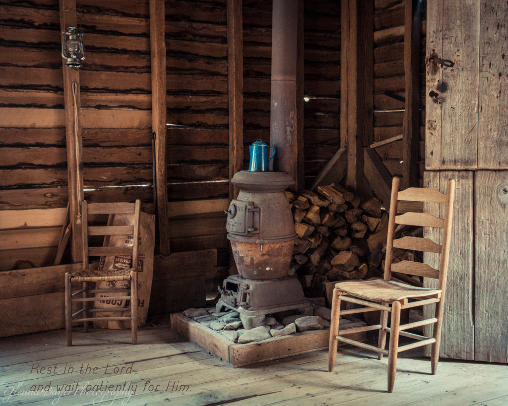 Potbelly stove and wooden chairs in the Mingus Mill in North Carolina with scripture verse