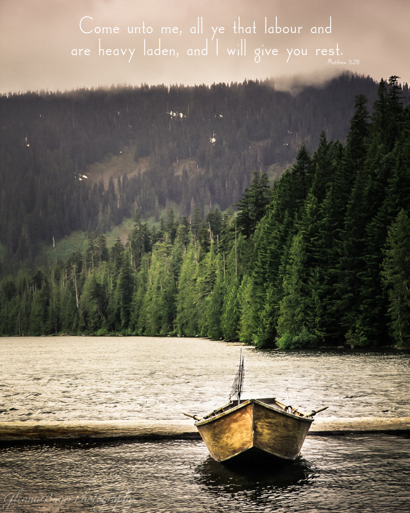 Old wooden fishing boat in Oregon lake with scripture verse