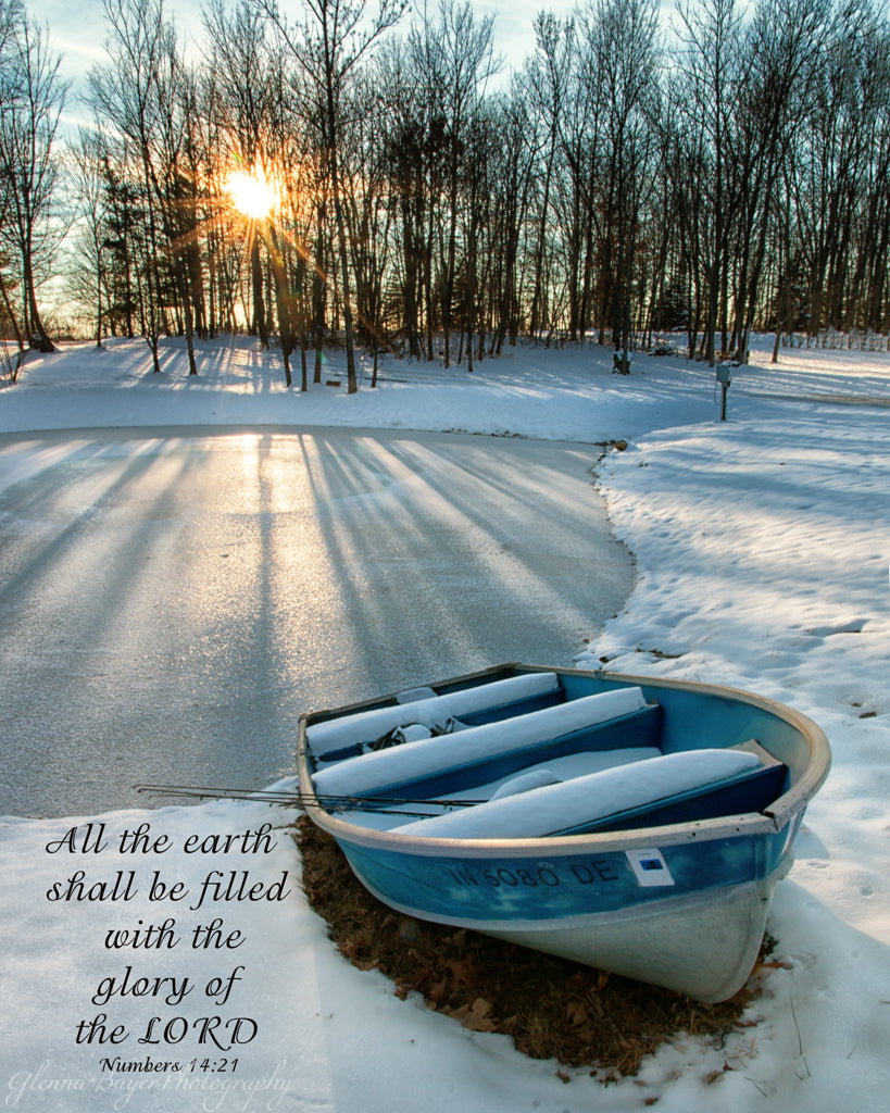 Old rowboat beside frozen pond at evening in Preble County, Ohio with scripture verse