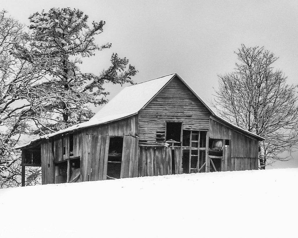 Old wood barn on hill in snow in Red Valley, Virginia