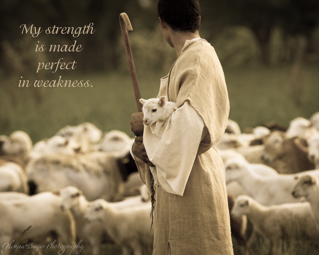 Shepherd with staff holding little lamb with flock of sheep with scripture verse