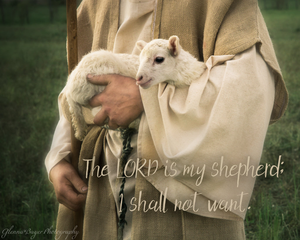 Shepherd carrying little lamb with scripture verse