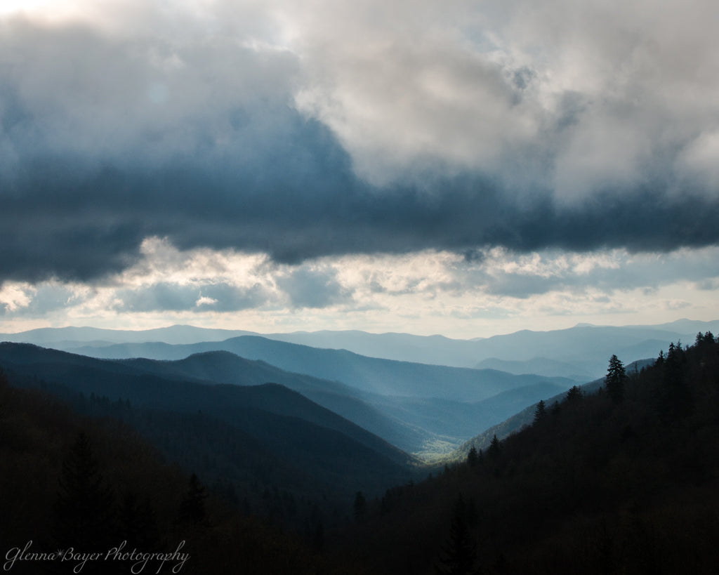 Sun shining in the Smoky Mountain valley during sunrise on cloudy day