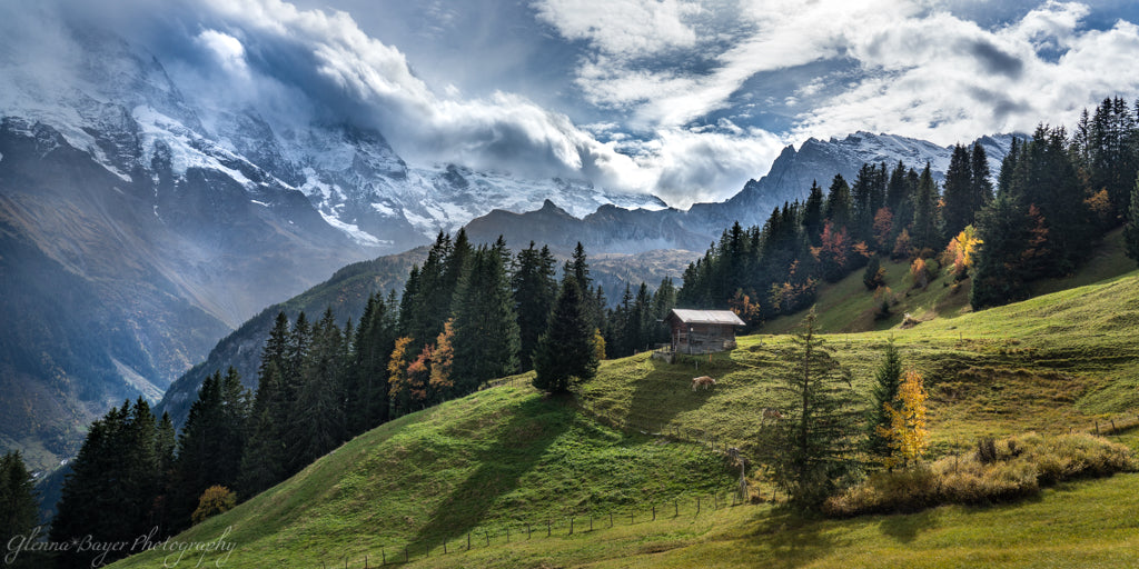 Grassy mountains and blue cloudy sky in the Swiss Alps in Murren, Switzerland